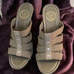 By Jessica- Olive Green, silver studded strap, 4 1/2” heal. Worn once.